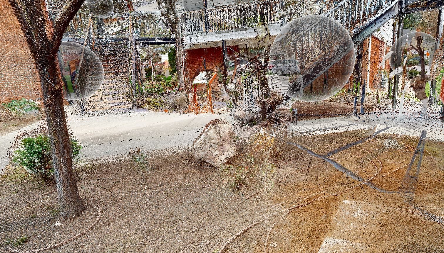 Registered point cloud of a courtyard and exterior stair, true colour, with scan targets