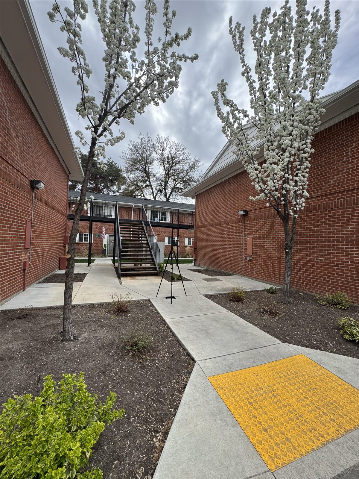 Terrestrial laser scanner on its tripod in the courtyard